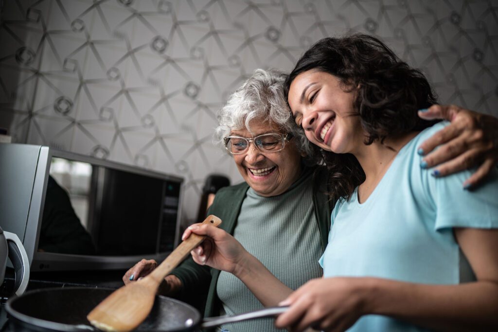 Image of mother and daughter cooking together